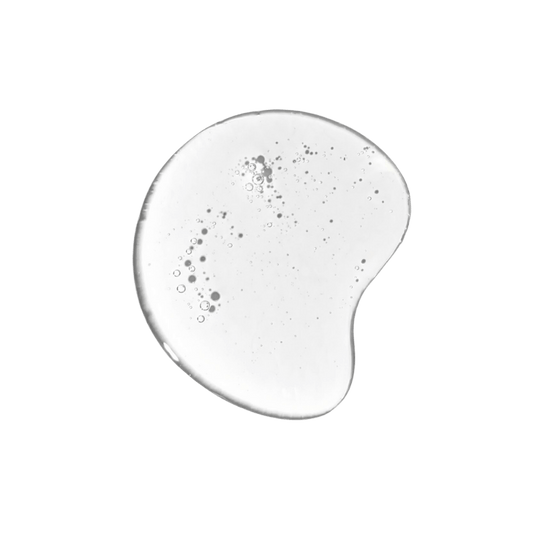 Close up of clear salicylic acid BHA serum texture for treating acne and blackheads.