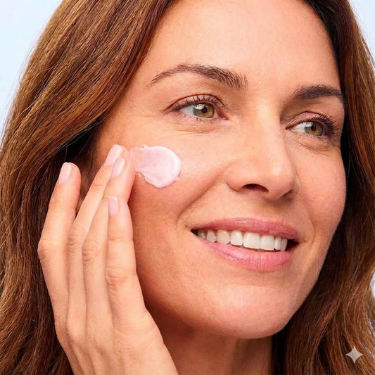 Woman applying a night cream for skin brightening before bed